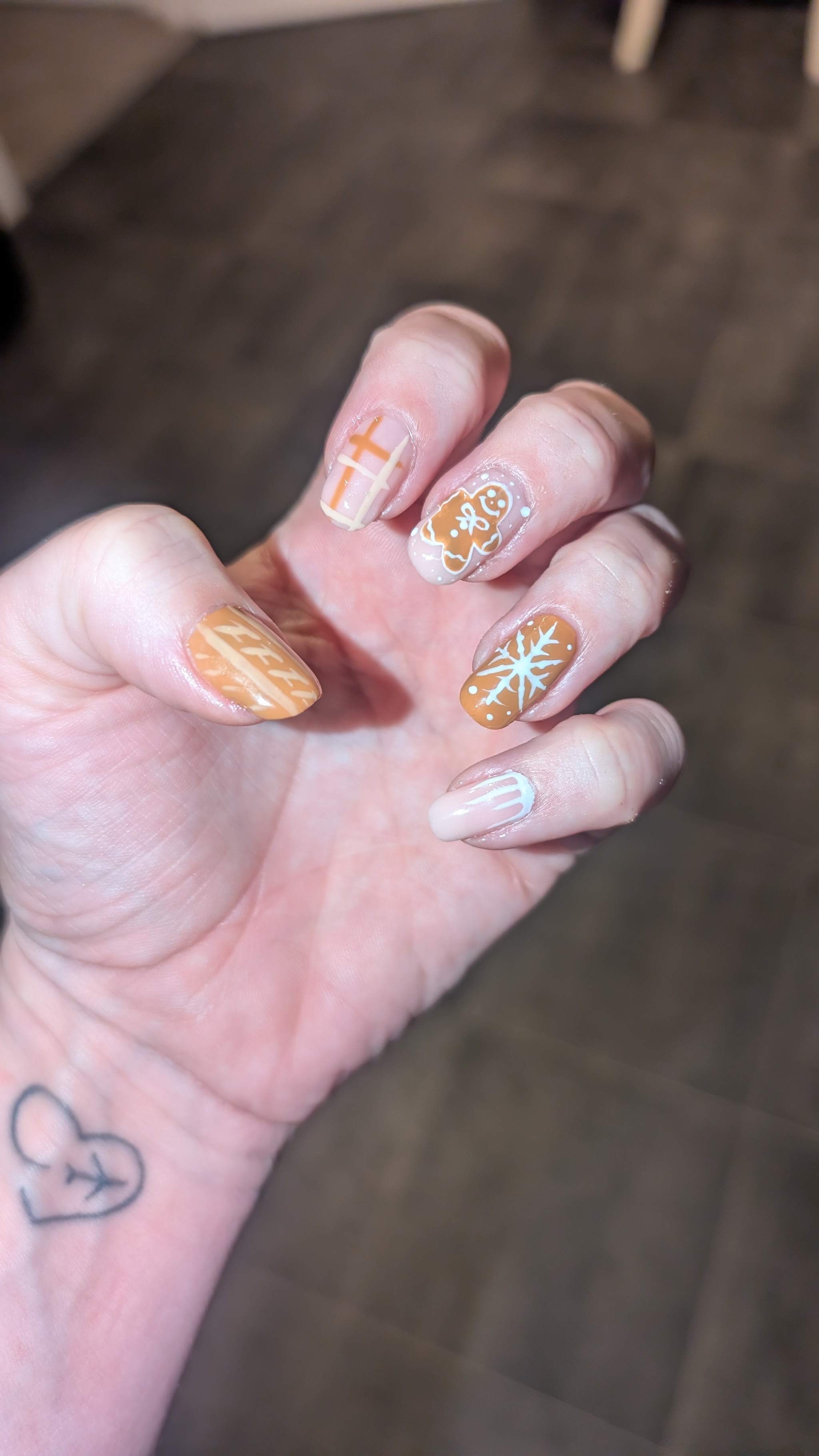 Autumn nail art with a pumpkin and leaf