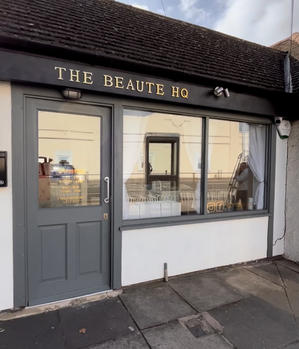The Beauté HQ shopfront with gold lettering above the grey door