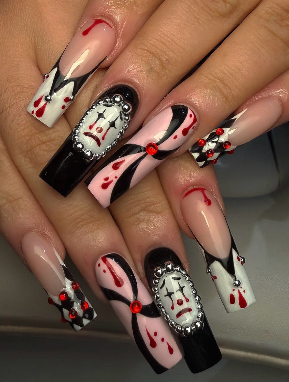 Halloween clown and drip design on long acrylics