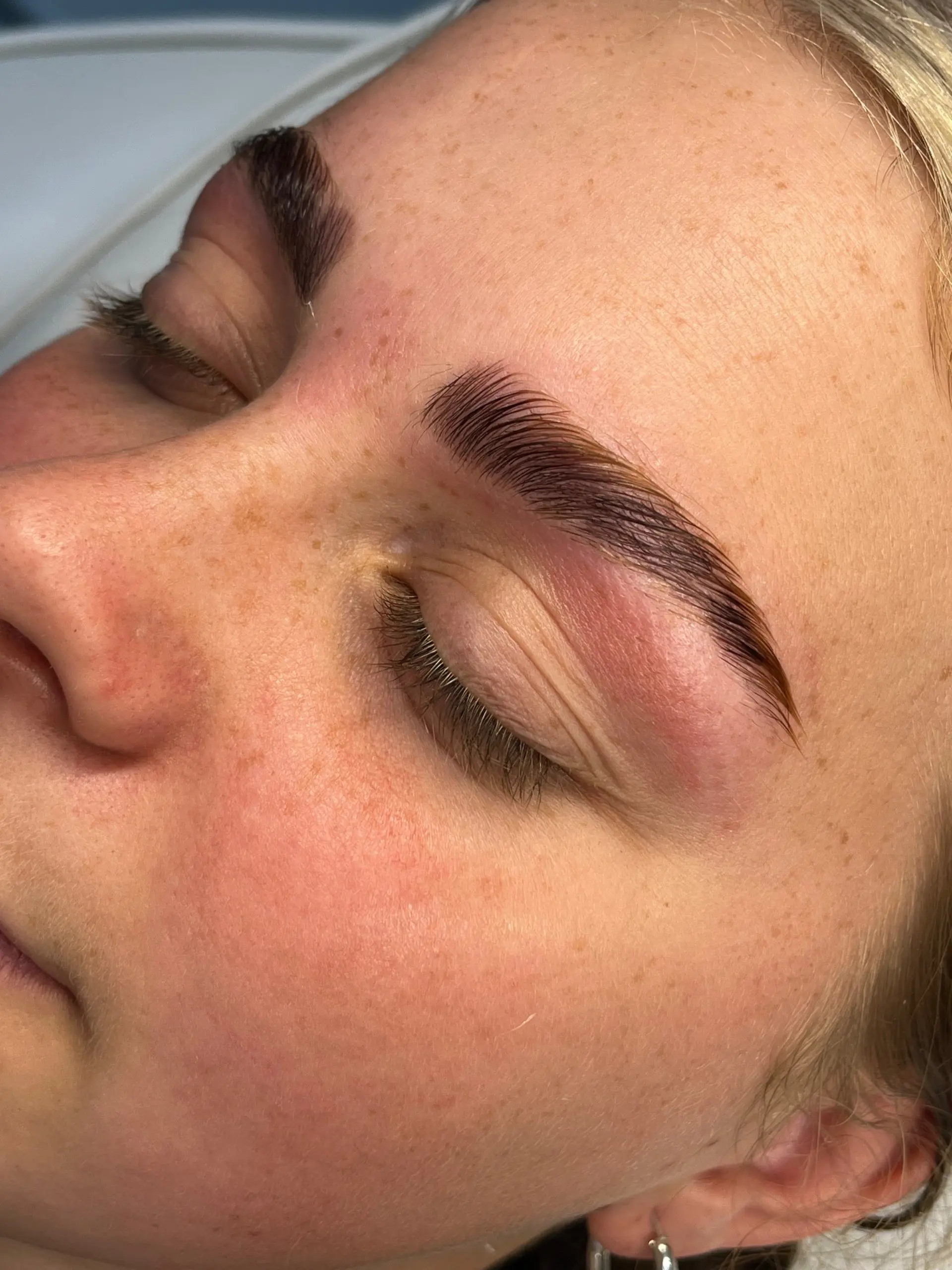 Laminated, shaped brows close up