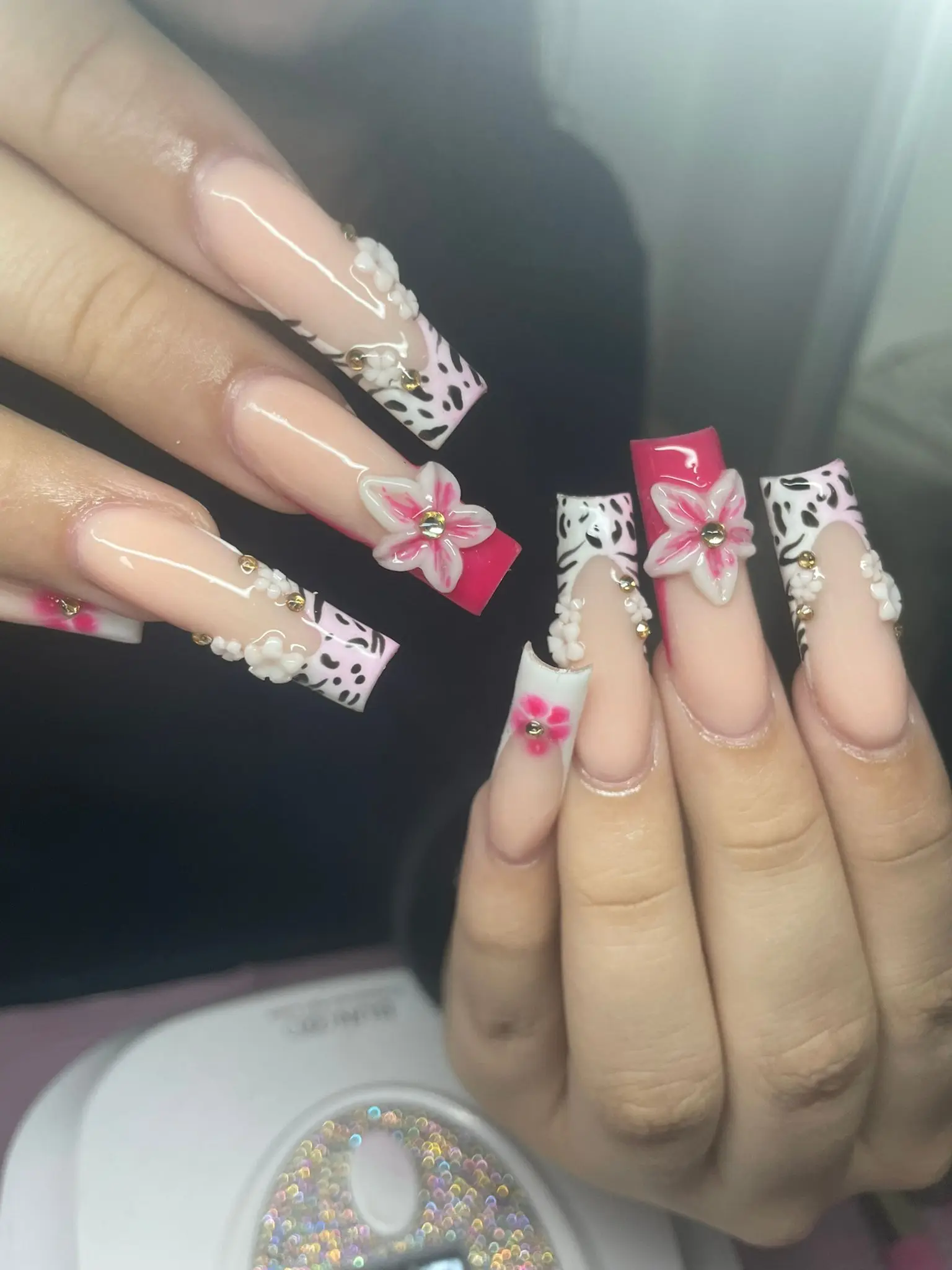 Long acrylics with cow print and pink 3D flowers